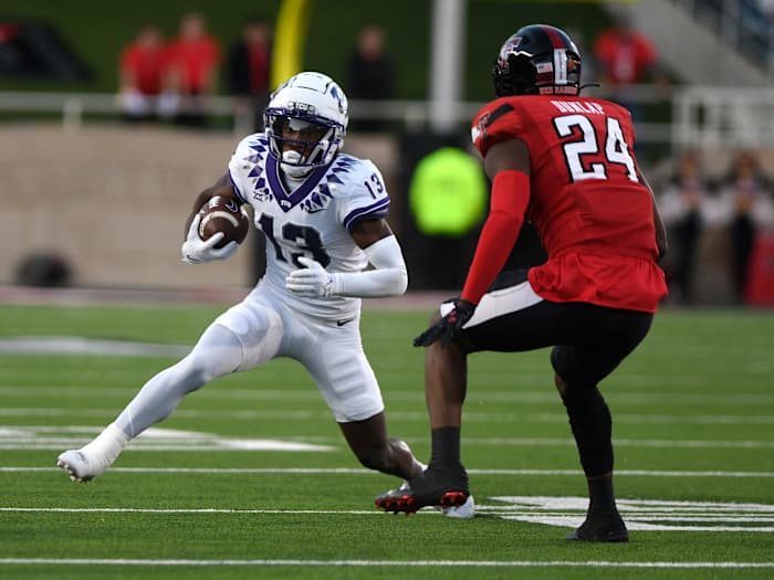 TCU's wide receiver Jaylon Robinson (13) runs with the ball against Texas Tech in a Big 12 football game, Thursday, Nov. 2, 2023, at Jones AT&T Stadium.